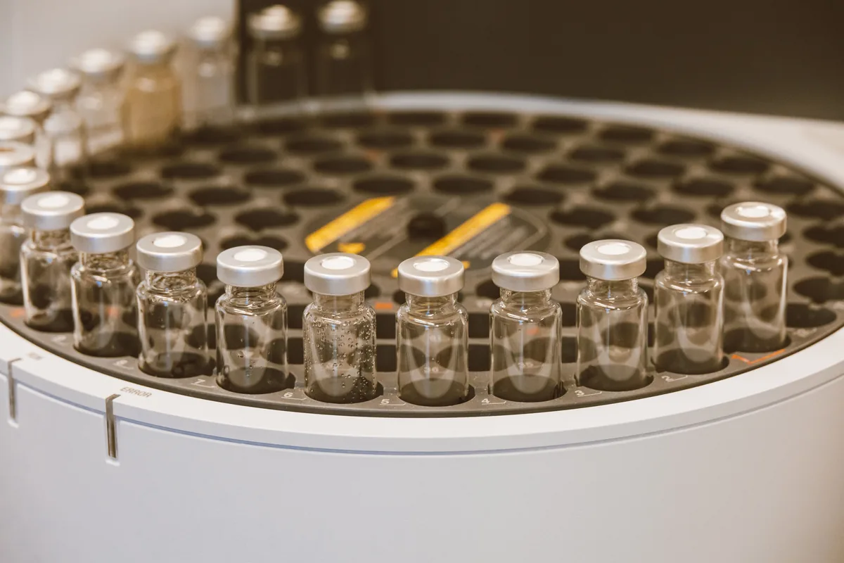 Laboratory vials holding well water samples ready for analysis